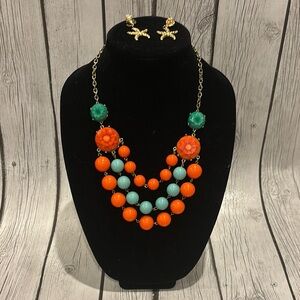 Coral and blue colored beaded statement necklace and starfish/shell earring